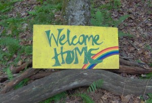 Welcome home with rainbow image symbolising the concept of the journey home